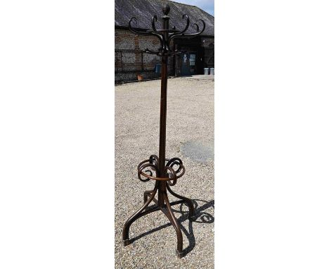 A Thonet style bentwood hall stand with eight scrolling coat/hat hooks (one damaged) and beehive finial, 200 cm high