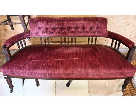 Edwardian mahogany two seater spindle back salon settee with ring turned supports and castors, 140 cm wide x 60 cm deep