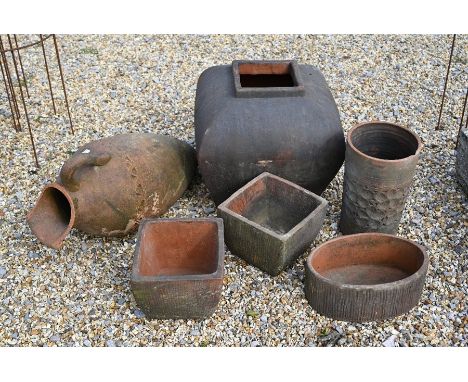A weathered terracotta planter of square tapering form 40 cm high to/w a terracotta olive jar 63 cm, cylinder planter 33 cm, 
