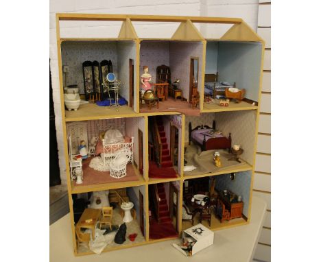 DOLLS HOUSE - a dolls house containing dolls and furniture set over 3 floors, including central hallways and 6 rooms. All roo