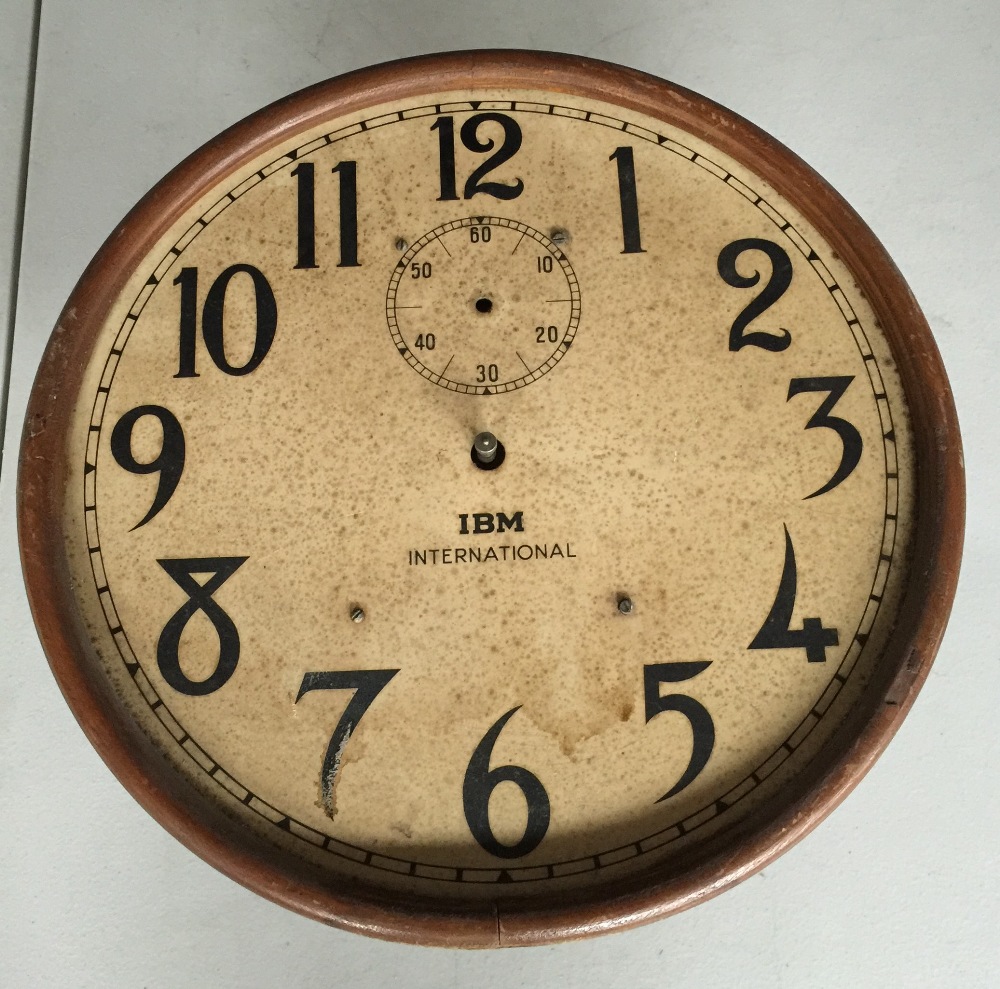 IBM SLAVE CLOCK foxing to dial and movement in need of repair.