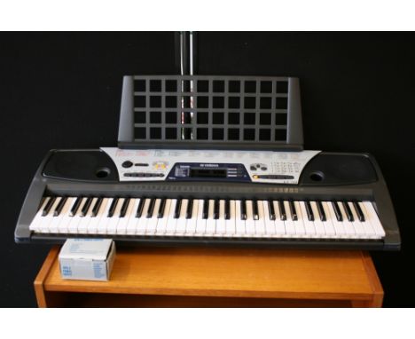 CASIO DIGITAL SYNTHESIZER - a boxed Casio CZ-101 Digital Synthesizer keyboard and an EZ-150 Yamaha full sized keyboard in ori