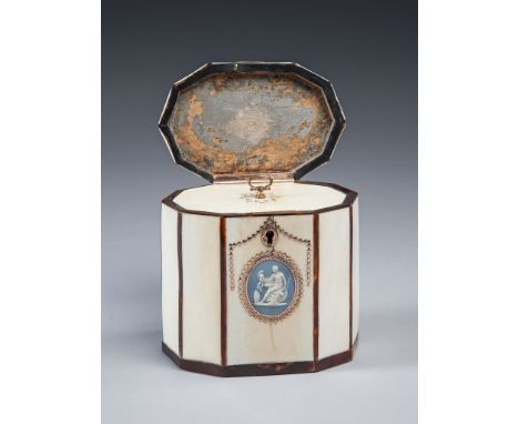 A George III Gold-Mounted Ivory and Toirtoiseshell Tea Caddy  the hinged lid with gold ring handle centring a star of mother-