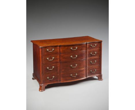 A George III Mahogany Commode  in the manner of Thomas Chippendale, the shaped top with a moulded edge and projecting front c