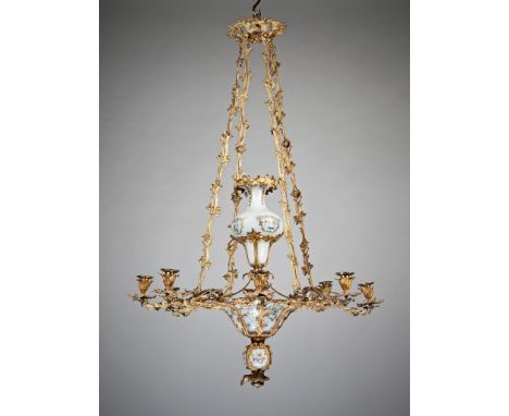 A Mid 19th Century French Ormolu and Opaline Chandelier  Suspended by four stylized foliate chains with opaline glass interio