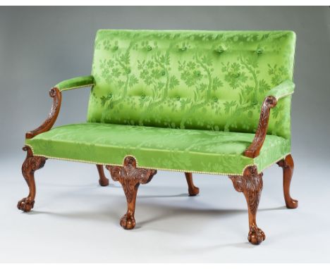 A George II Carved Walnut Settee, Possibly by Giles Grendey  the scrolling arm supports finely carved with acanthus decoratio