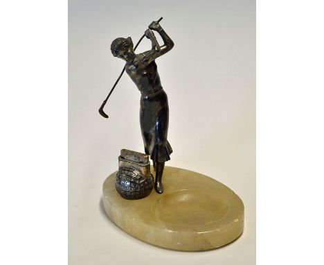 Spelter golfing figure of lady mounted on an oval onyx base ashtray c/w a square mesh golf ball lighter - overall 8"h