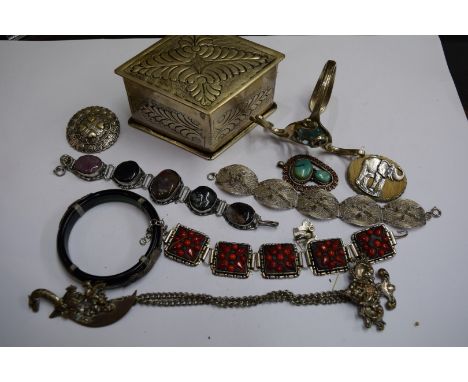 A selection of ethnic jewellery; to include a green stone bangle; a metal clock fastener; a contemporary metal arm bangle; a 