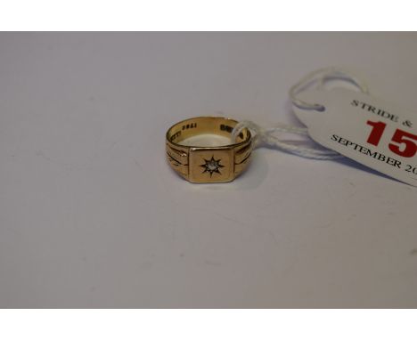 A gentleman's 9ct gold signet ring set central diamond.