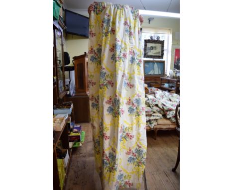 A pair of heavily lined curtains, in cotton sateen finish pink pansy pattern fabric, approximately 150cm drop; together with 