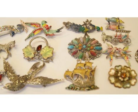 A small collection of enamel brooches set marquesite and coloured glass.