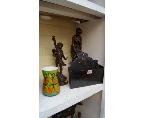 A Poole Pottery vase; together with a papier-mache letter rack; and two spelter figures.