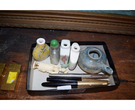 A mixed lot, to include: two Dunhill gilt lighters; another gilt lighter; four Chinese snuff bottles; fountain pens; an ivory