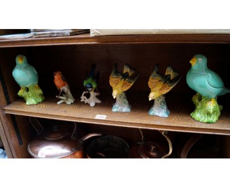 Two Beswick yellow glazed birds, model 928; together with a Goebel robin; and three others. 