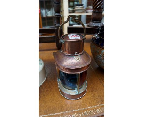 An old copper ship's lantern, with red and blue glass lens, height including handle 27cm. 