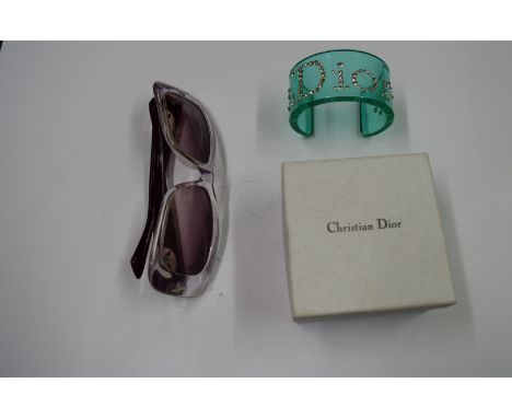 Christian Dior & Armani: a turquoise perspex cuff bracelet decorated diamante 'Dior', boxed; together with a pair of 1980s Ar