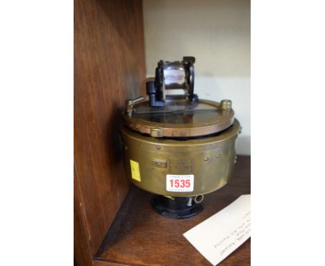 A World War II 02B aircraft compass, No 5831-8-H, with Air Ministry plaque.