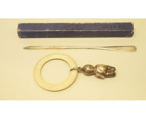 A silver HMS Coventry oar, engraved Jordan 1934; together with a silver and composition teething ring and rattle.