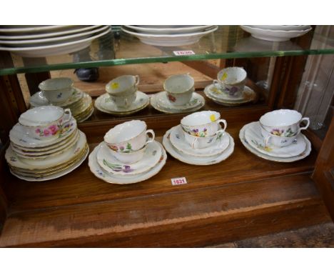 A set of seven floral painted Meissen saucers and teacups, (some seconds).