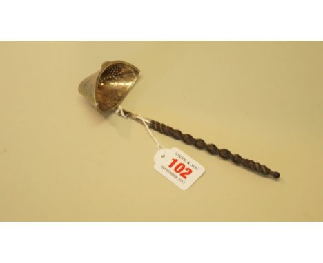 A Dutch silver pierced ladle having turned wooden handle, import mark Berthold Herman Muller, London 1915, 19cm.