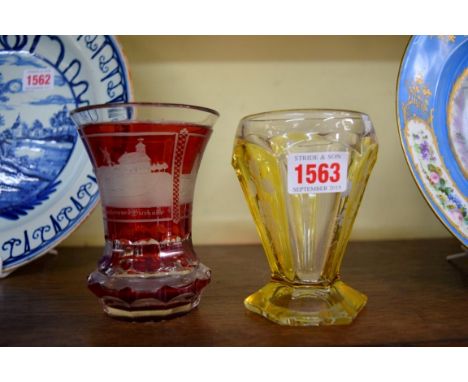 A 19th century German 'Spa' ruby flash beaker engraved with scenes of Wiesbaden; together with another amber flash example. 