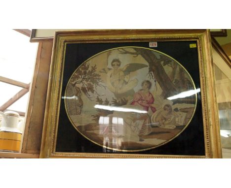 A Georgian silk needlework panel of figures, 41 x 49cm, oval, in a verre eglomise mount.  Condition Report: Overall condition