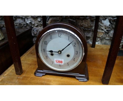 A 1940s Enfield brown Bakelite mantel clock, 20cm high.  