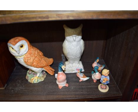 A Beswick barn owl, No.1046; together with a Belleek owl; a Hummel figure; and four pottery mallards, (repair to neck of one)