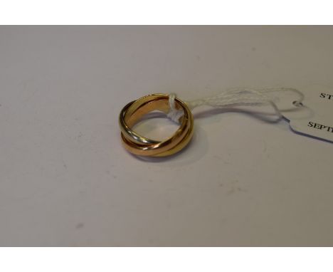 Cartier: an 18ct three colour gold wedding ring, 8.9g. Condition Report: Overall condition is good, however there is slight s