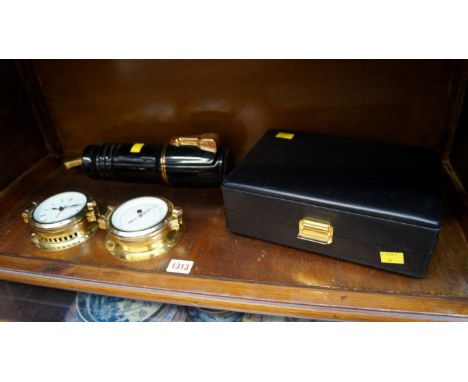 An Italian black leather watch collector's box; together with a novelty pen box; and a brass two piece clock and barometer se