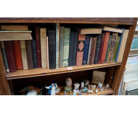 A shelf of hardback books. 