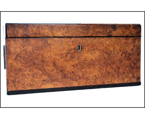 An early 19th century Georgian walnut caddy box of rectangular form&nbsp; The hinged lid opening to reveal a fully appointed 