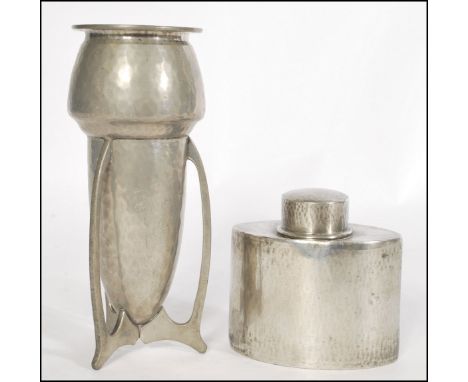 An Arts &amp; Crafts English pewter tea caddy Of oval form being made by Liberty &amp; Co. Planished decoration with impresse