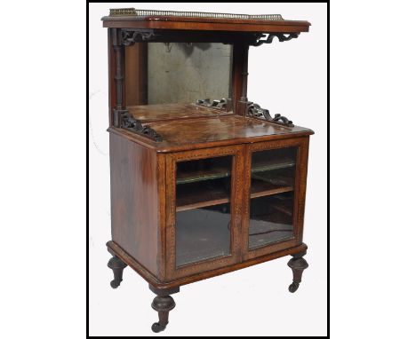 An exceptional high Victorian walnut and tunbridge inlaid music cabinet being raised on turned legs with glass cabinet. Above