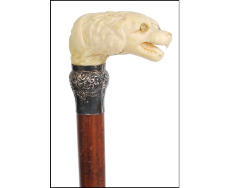 A fantastic 19th century Victorian walking stick cane having a tapering Malacca shaft with ivory figural handle. The handle h