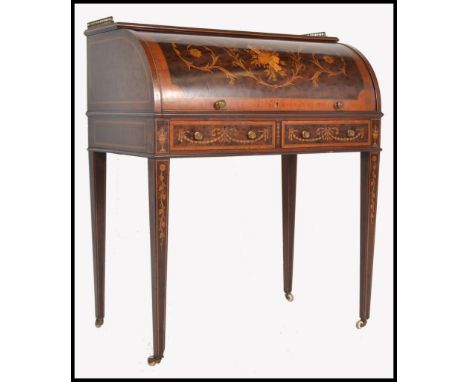 A late 19th century mahogany and satin wood inlaid roll top bureau desk. Raised on square tapering legs with white ceramic ca