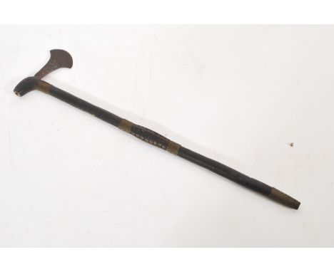 An African tribal art war club with small worked axe head, the shaft with wire binding and concentric circles decoration