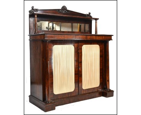 A Good Regency 19th century rosewood chiffonier - pier cabinet having a plinth base with column supports flanking a pair of c