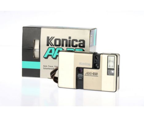 A Konica AA-35 Half Frame 35mm Compact Camera, gold, body F-G, corrosion to battery terminals, optics F-G, some haze &amp; fu