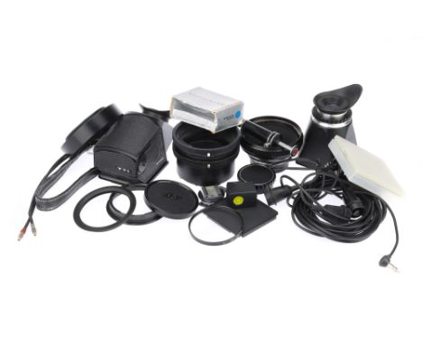 A Good Selection of Hasselblad Accessories, including film advance knob, Hasselblad to Nikon adapter, sports viewfinder and m