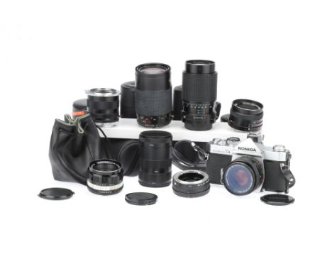 A Konica Auto Reflex T3 35mm SLR Camera Outfit, chrome, body G, shutter working, meter appears to respond to light, not teste