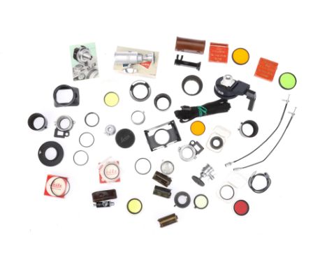 A Tray of Leitz Camera Accessories items include filters, film canisters, viewfinders, cable releases, ball and socket heads,