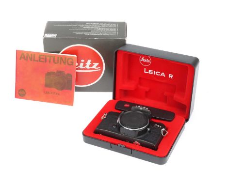 A Leitz R4s 35mm SLR Camera, black, body G-VG, shutter working, with body cap, instructions, base cover, hard shell box, & ma