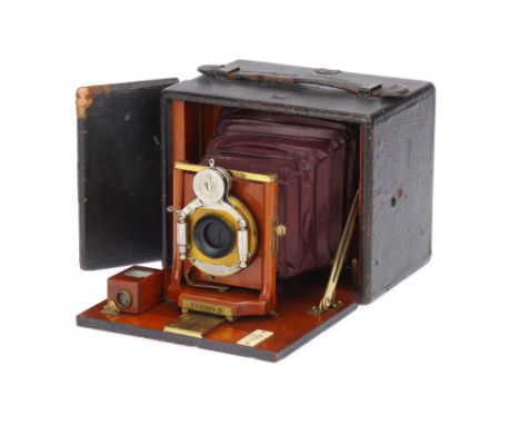 A Rochester Optical Co. Premo B 4 x 5" Folding Plate Camera serial no. 36019, c. 1900, maroon bellows, with f/8 lens in Bausc