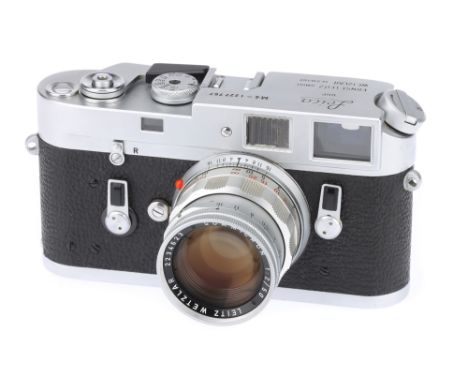 A Leica M4 Rangefinder Camera, 1970, chrome, serial no. 1227767, with Leitz Summicron f/2 50mm lens, chrome, serial no. 22346