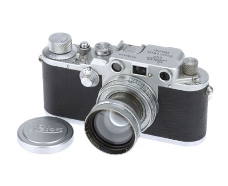 A Leica IIIc Rangefinder Camera, 1941/42, chrome, serial no. 382429, with Leitz Summitar f/2 50mm lens, chrome, serial no. 56