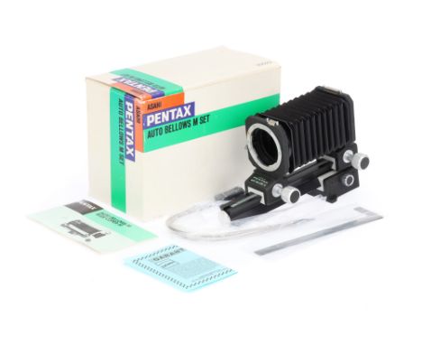 An Asahi Pentax Auto Bellows M with a double cable release, two metal focusing scales and instruction manual and maker's box,