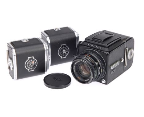 A Hasselblad 500CM Medium Format Camera, black, serial no. RV1258059, with Carl Zeiss Planar T* f/2.8 80mm lens, black, seria