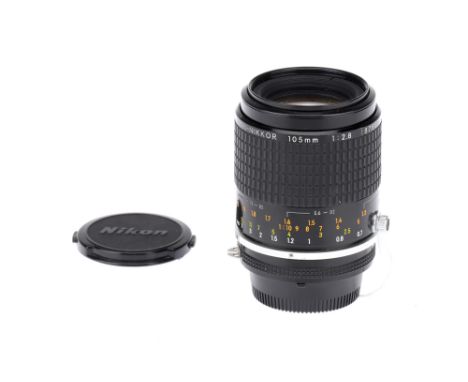 A Nikon Micro-Nikkor f/2.8 105mm Lens, black, body VG-E, optics VG, some light dust present, with maker's front & rear capsNo