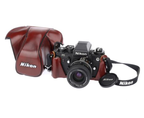 A Nikon F3 HP SLR Camera black, serial no. 1558945, with Nikon Zoom-Nikkor f/3.3-4.5 35-70mm lens, black, serial no. 2269608,